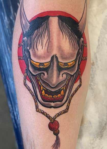 Devil's face coloured tattoo