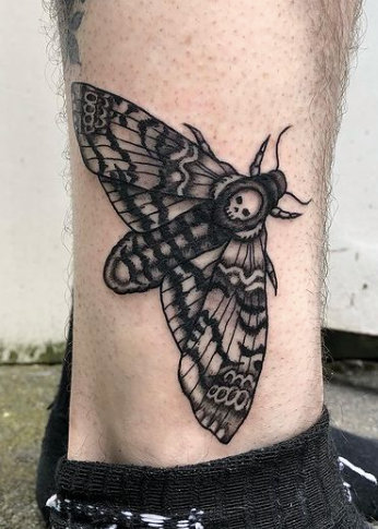 butterfly and skull black ink tattoo